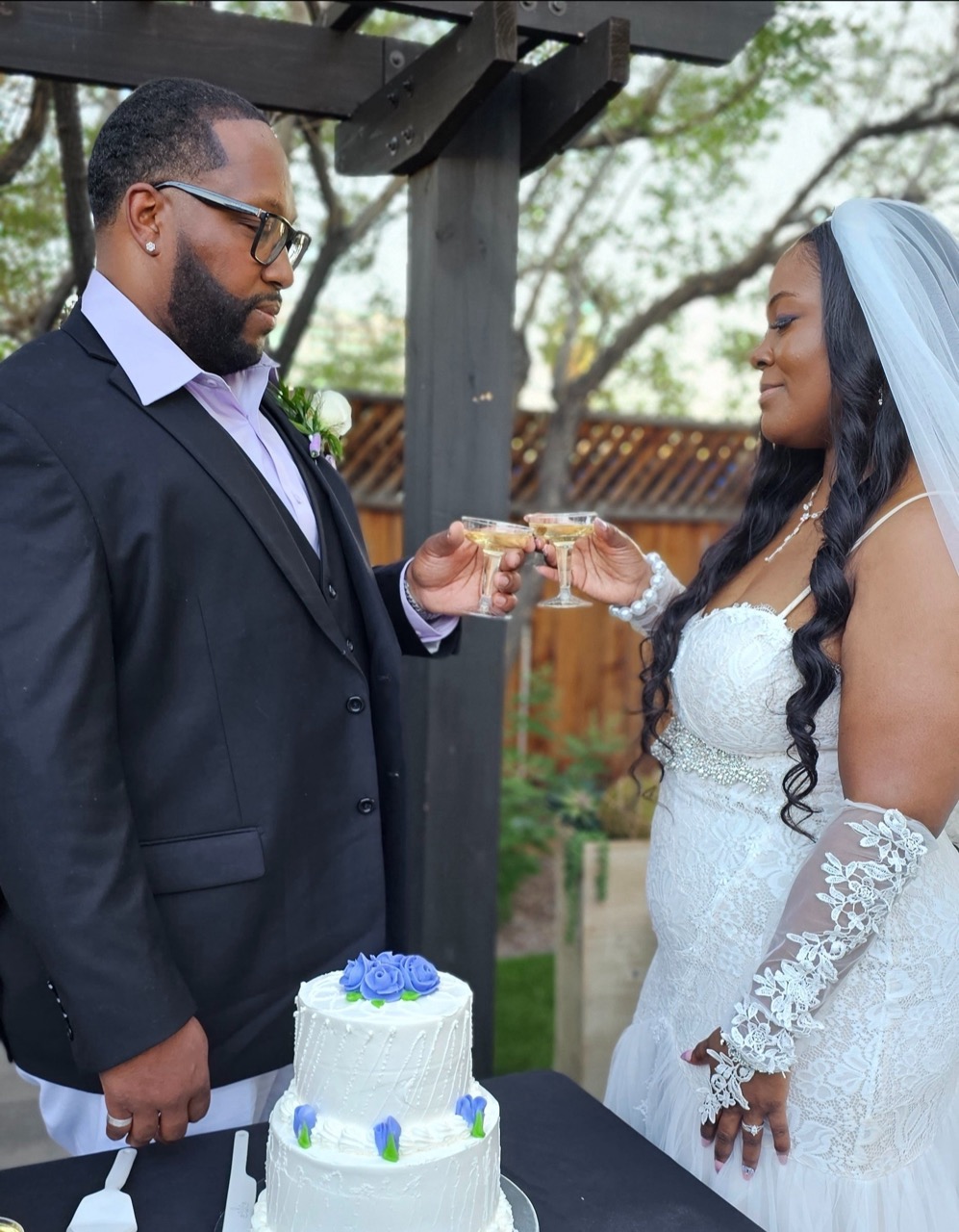 Just-married couple celebrating with champagne outside a Las Vegas chapel