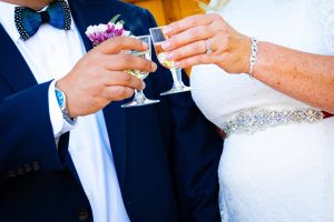 Just-married couple celebrating with champagne outside a Las Vegas chapel