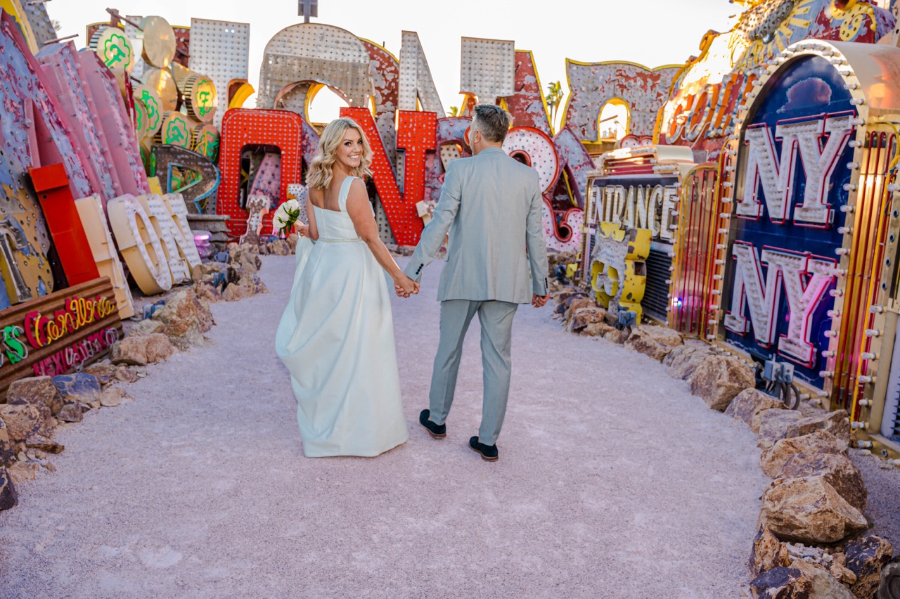 Stylish wedding portrait with retro Las Vegas signage at the Neon Museum