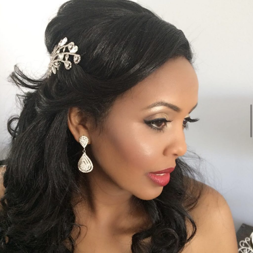 Professional bridal makeup artist styling bride’s hair in Las Vegas