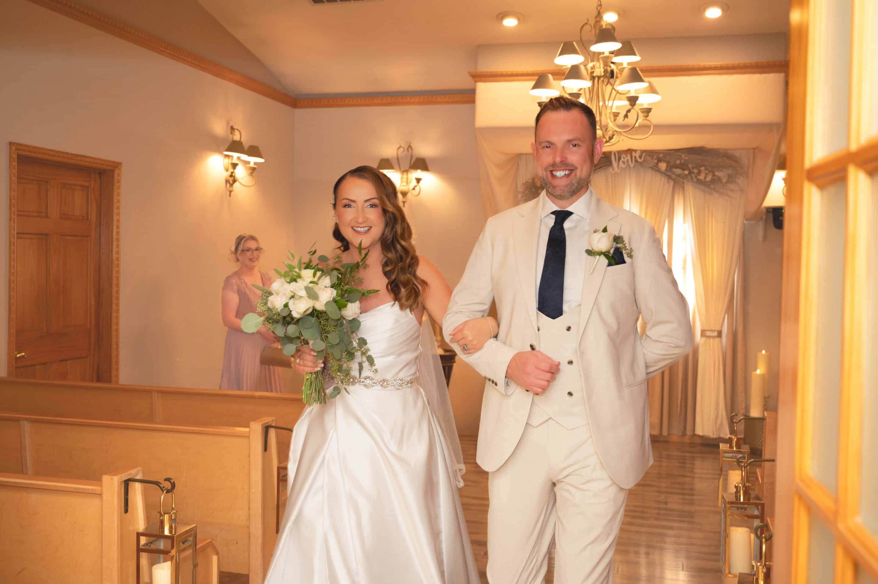 Elegant Las Vegas wedding ceremony inside Mon Bel Ami Chapel with floral décor and candlelight.