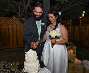 Bride and Groom cutting Las Vegas Wedding Cake at reception
