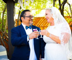 3514371214 Large Just-married couple celebrating with champagne outside a Las Vegas chapel