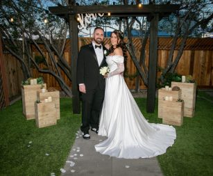 Photojournalistic candid wedding shot of guests celebrating reception